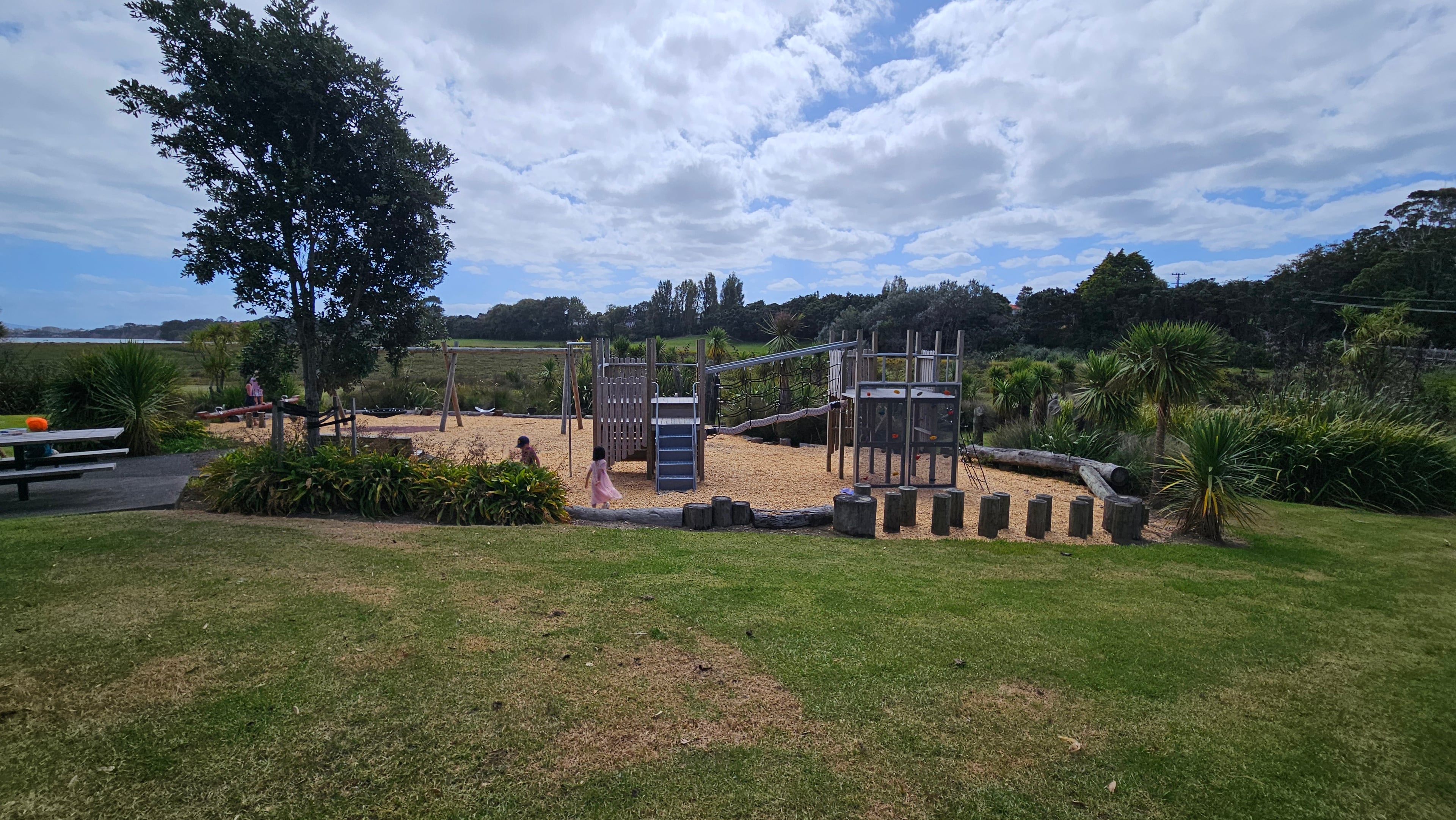 Small but really pretty. The playground sits in a green, tree-lined space with open views — a much nicer setting than most neighbourhood playgrounds.