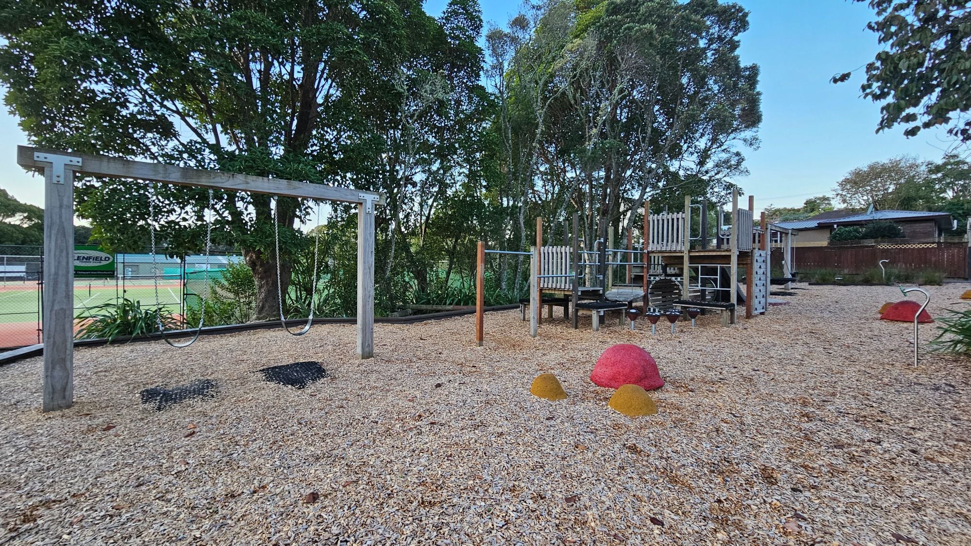Kids on the 360° swing at Elliot Reserve Playground