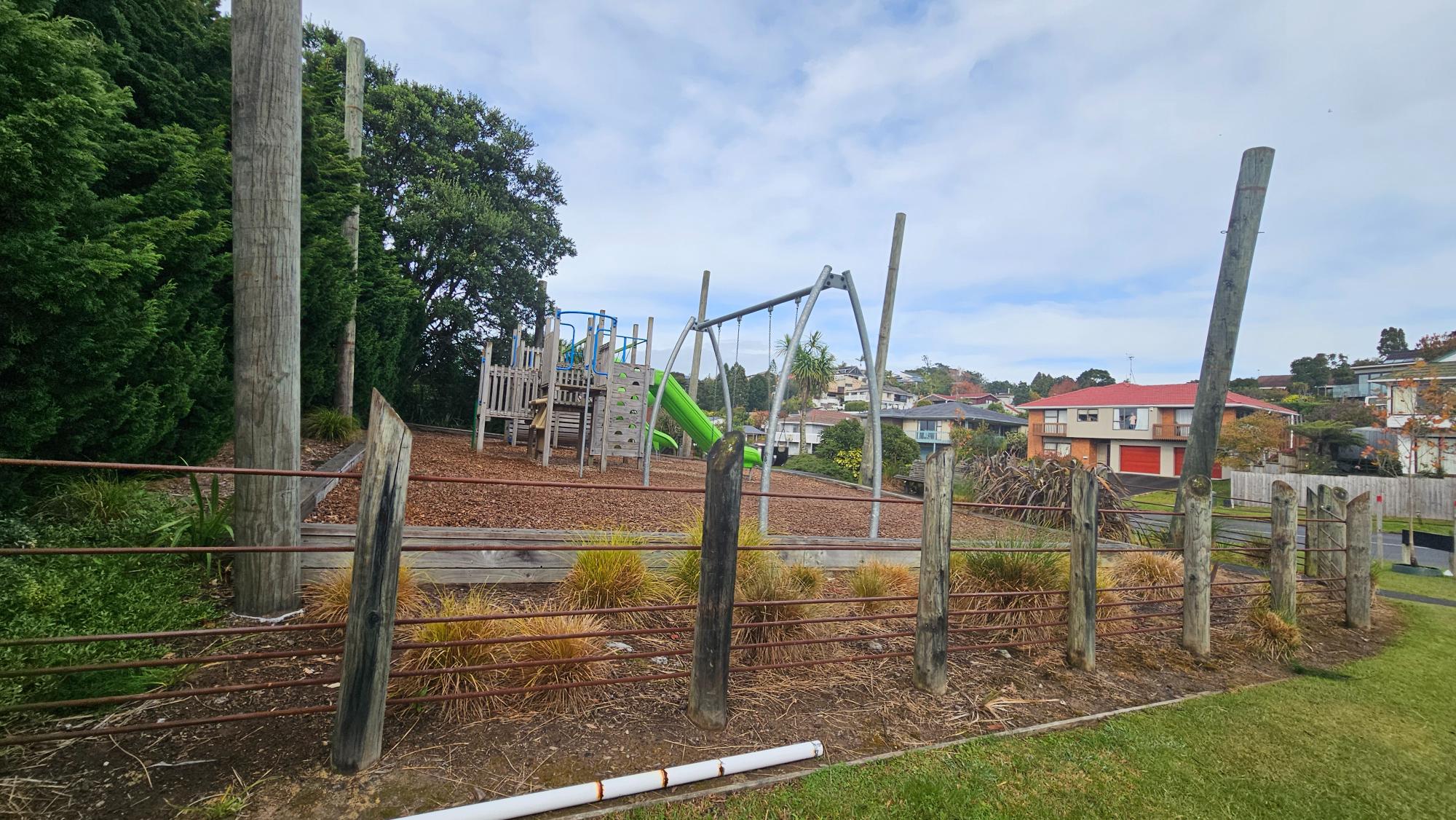 The playground is fully enclosed by a fence - not the most attractive one, admittedly.