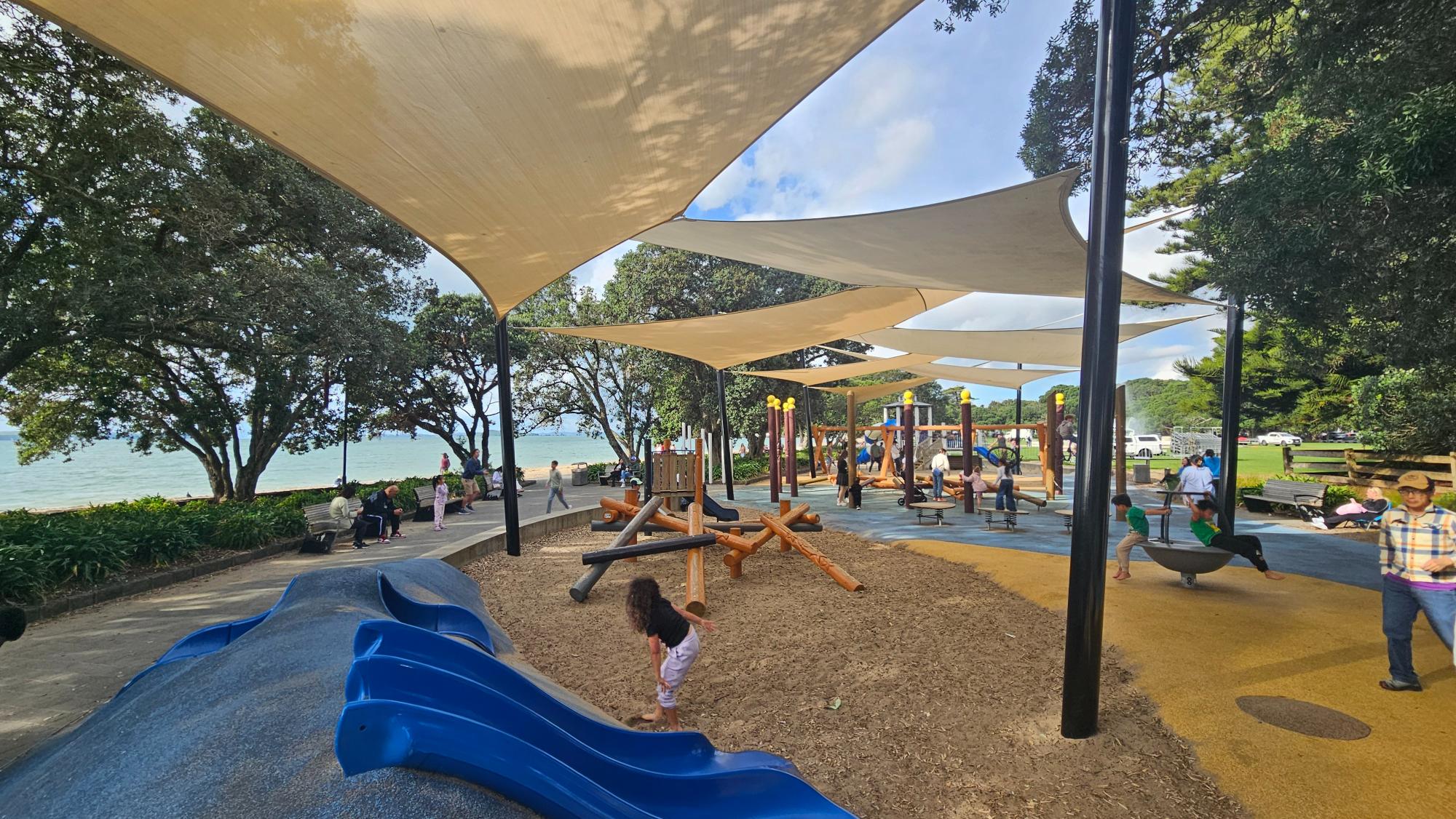 Balance beams and jumping blocks in the shaded younger children's area