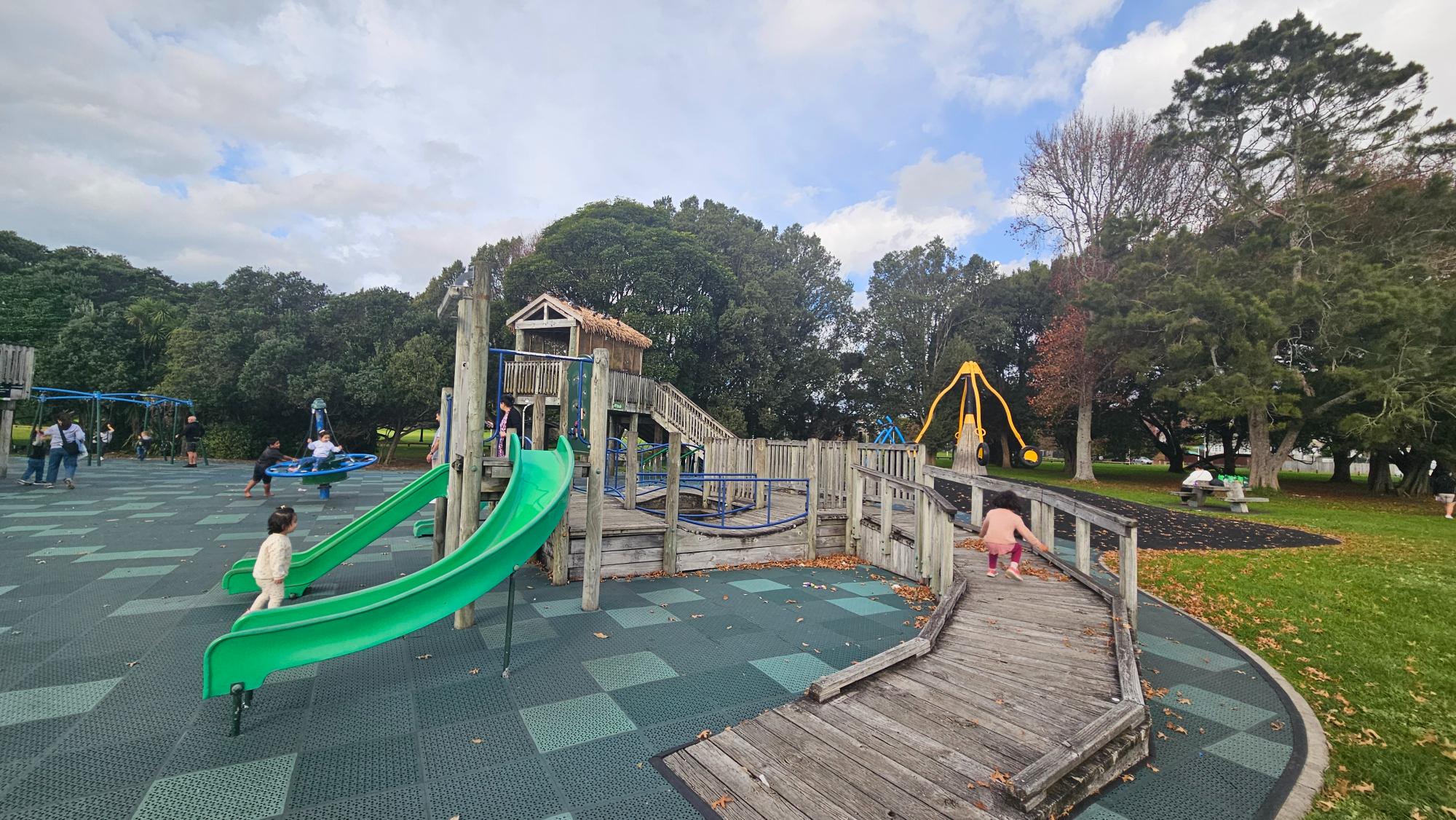 Waka-inspired fort with green slides and elevated walkways at Ōrākei Domain