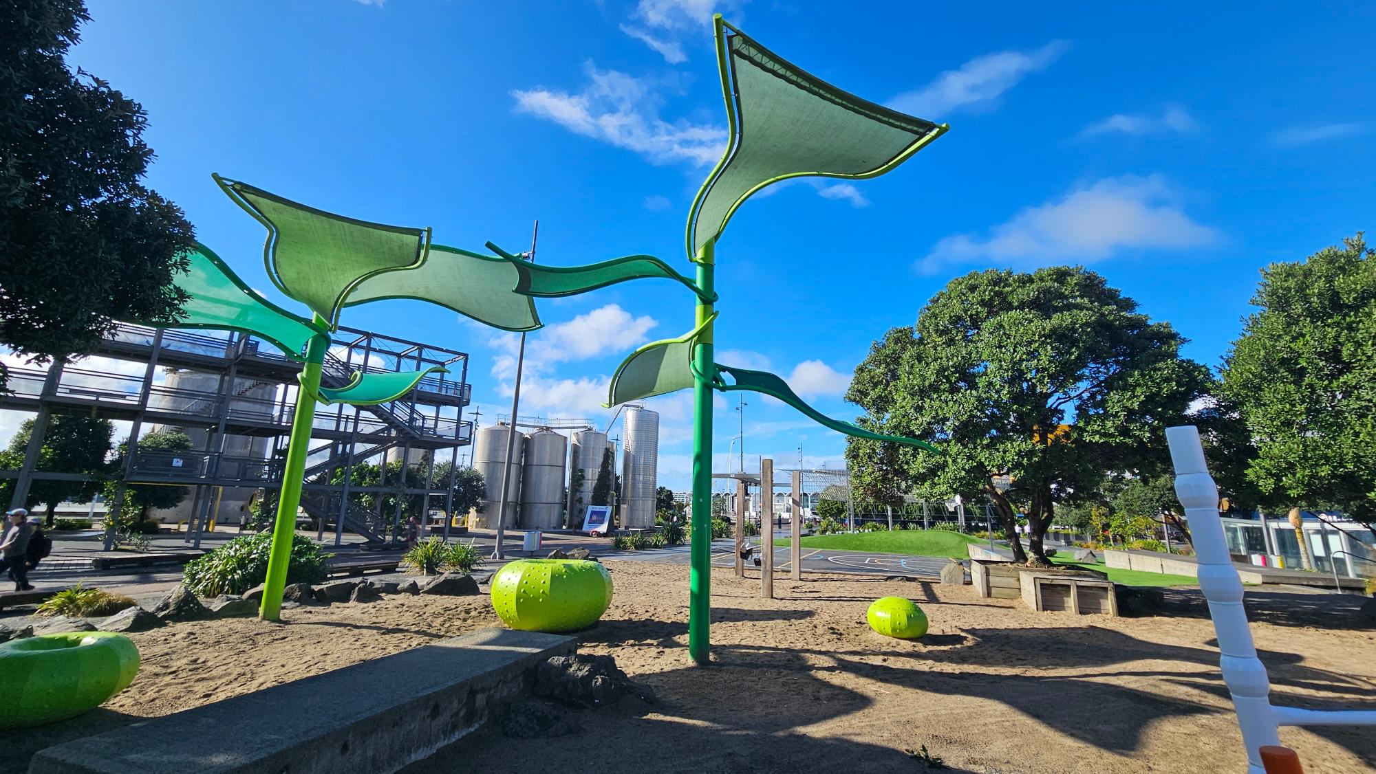 Leaf-shaped shade structures add character, though they block less sun than traditional canvas sailor shades