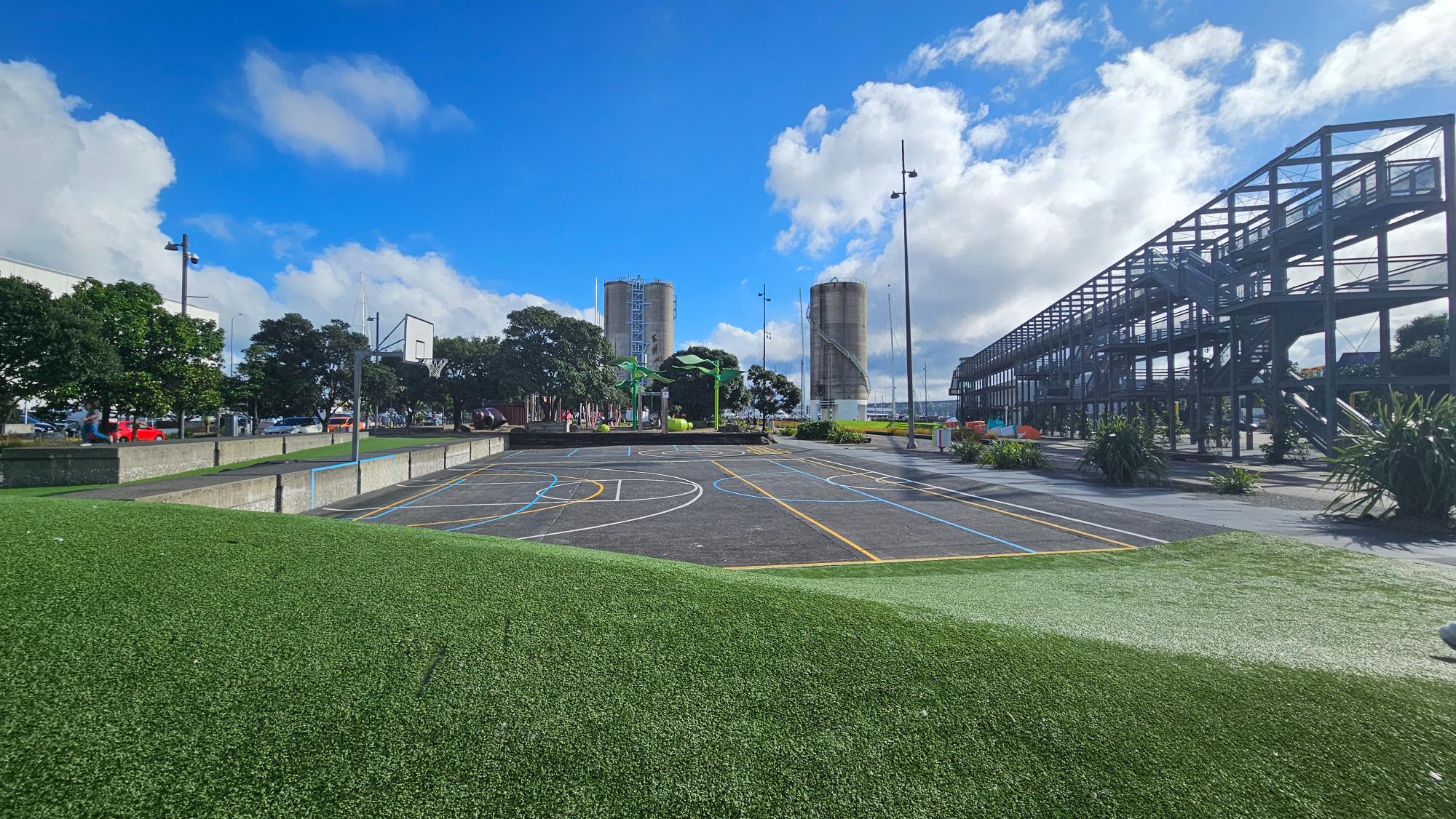 Basketball courts and other waterfront attractions sit right beside the playspace