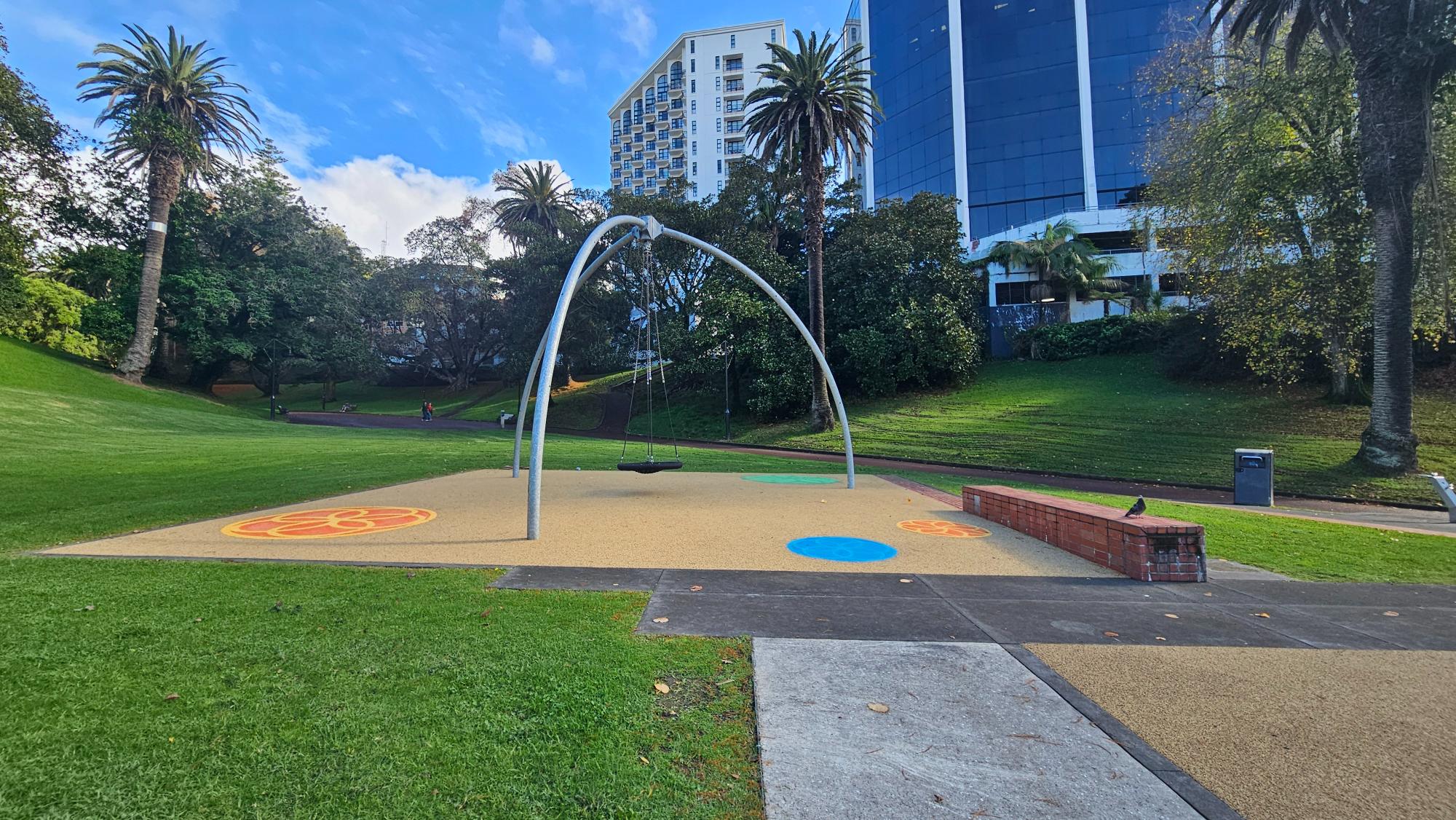 A single net swing in a wide open corner — competitive for turns, but kids love the openness and park views