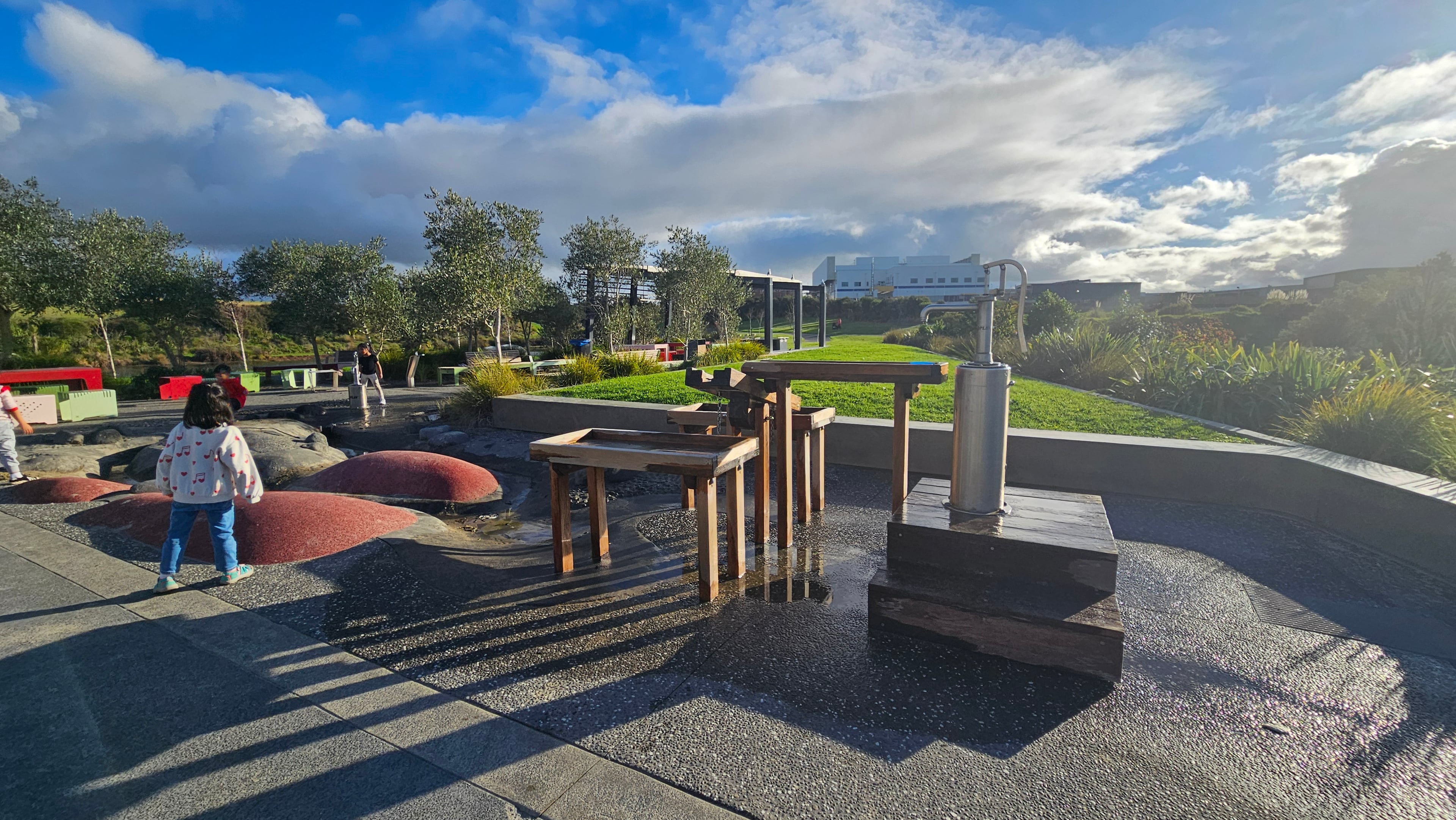 Water play channel with wooden sluice gates — a clear favourite with kids