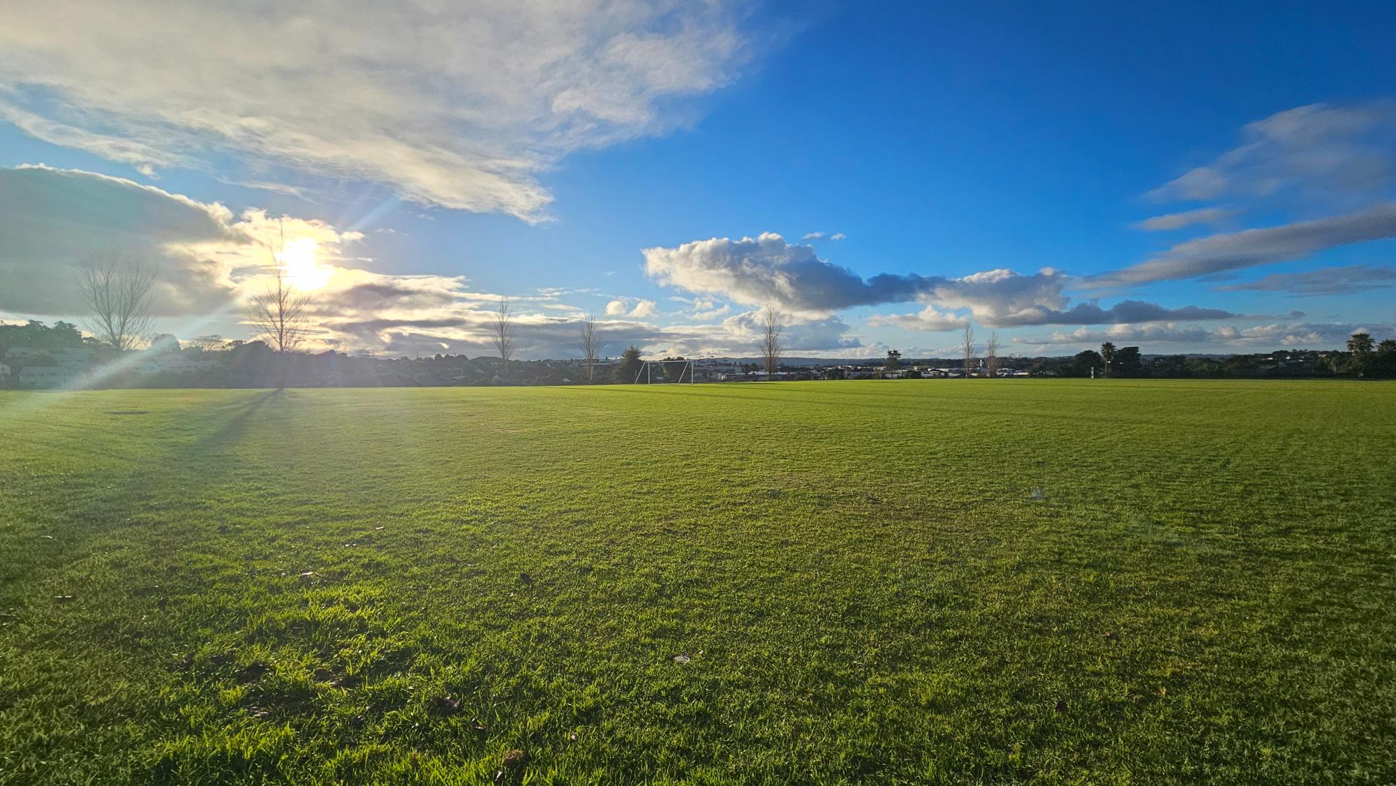 A huge sports field below the main playground — easy to miss from above