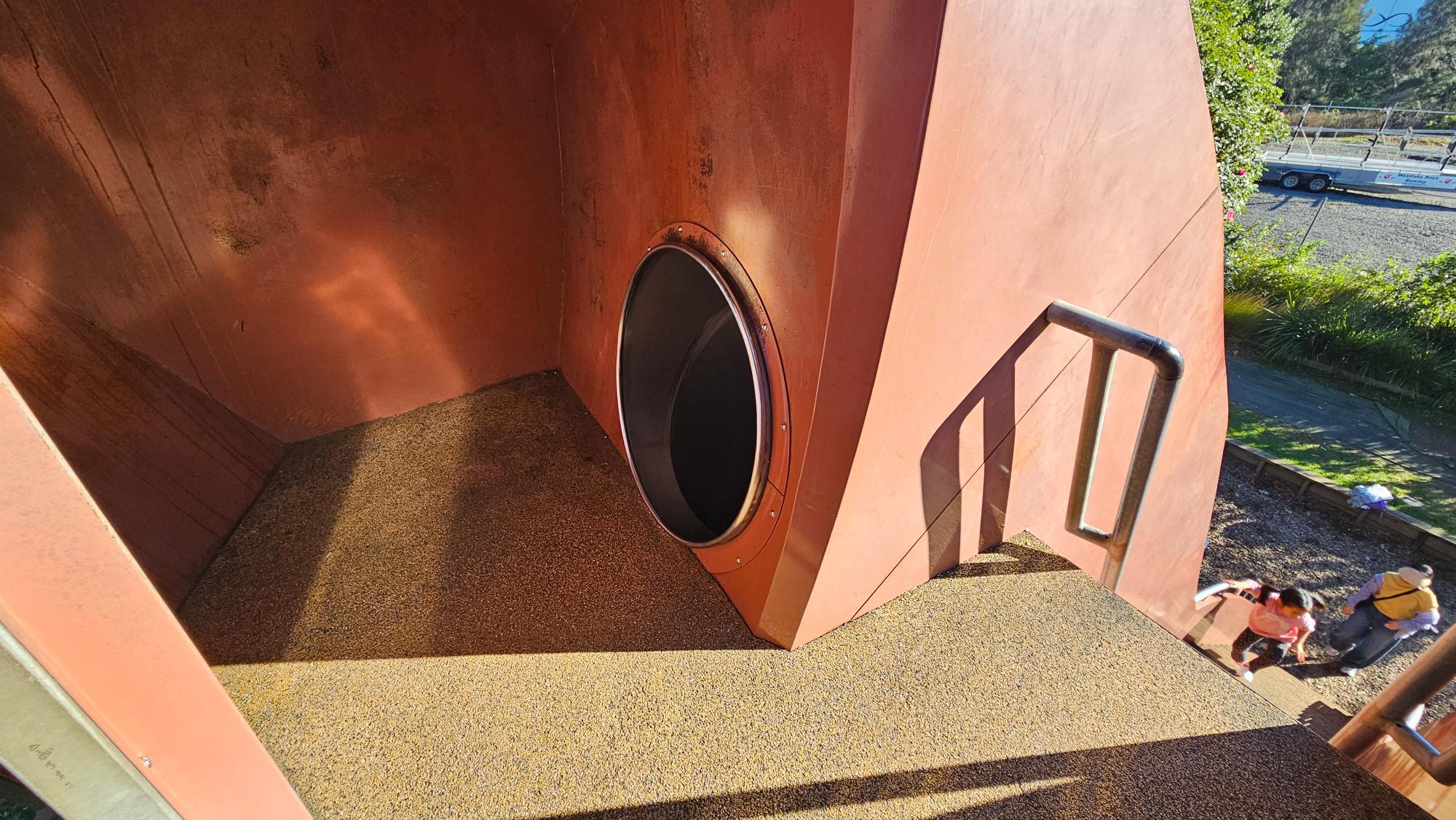 The metal slide down the side of the bird — faster than it looks from a distance
