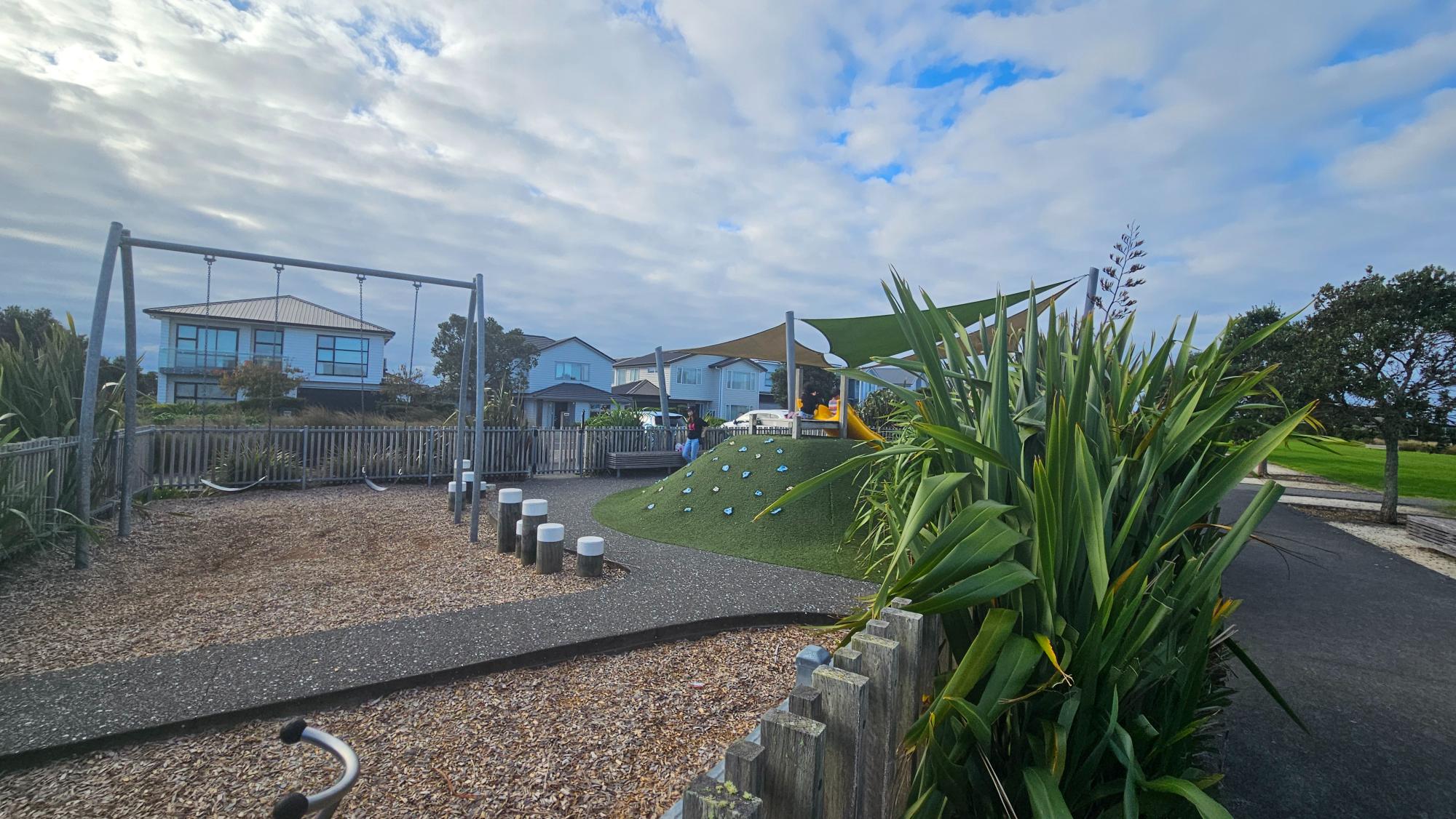 The playground’s toddler section is completely fenced in.