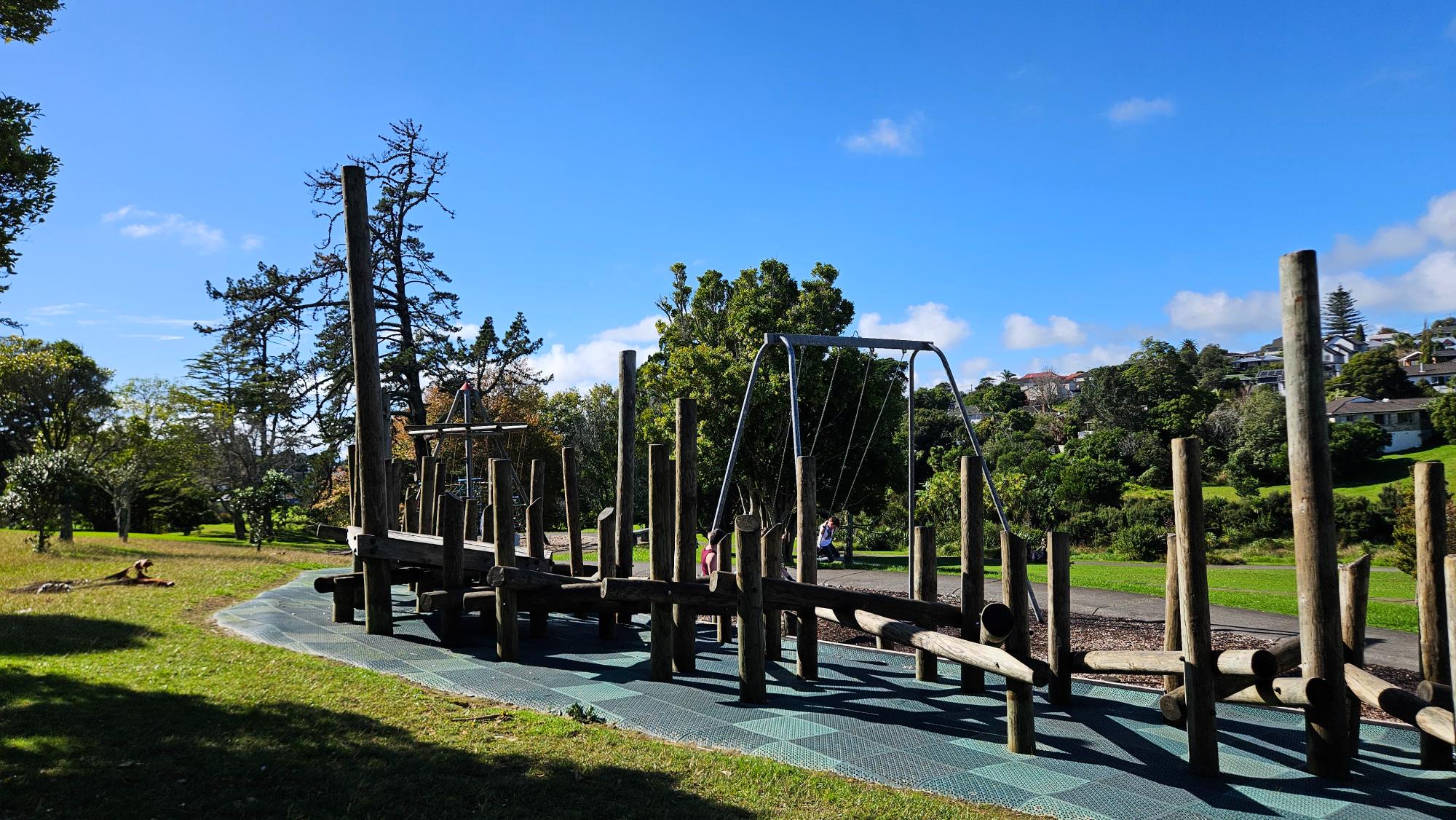 Stepping-bridge divide between toddler and older-kid play zones at Sherwood Reserve