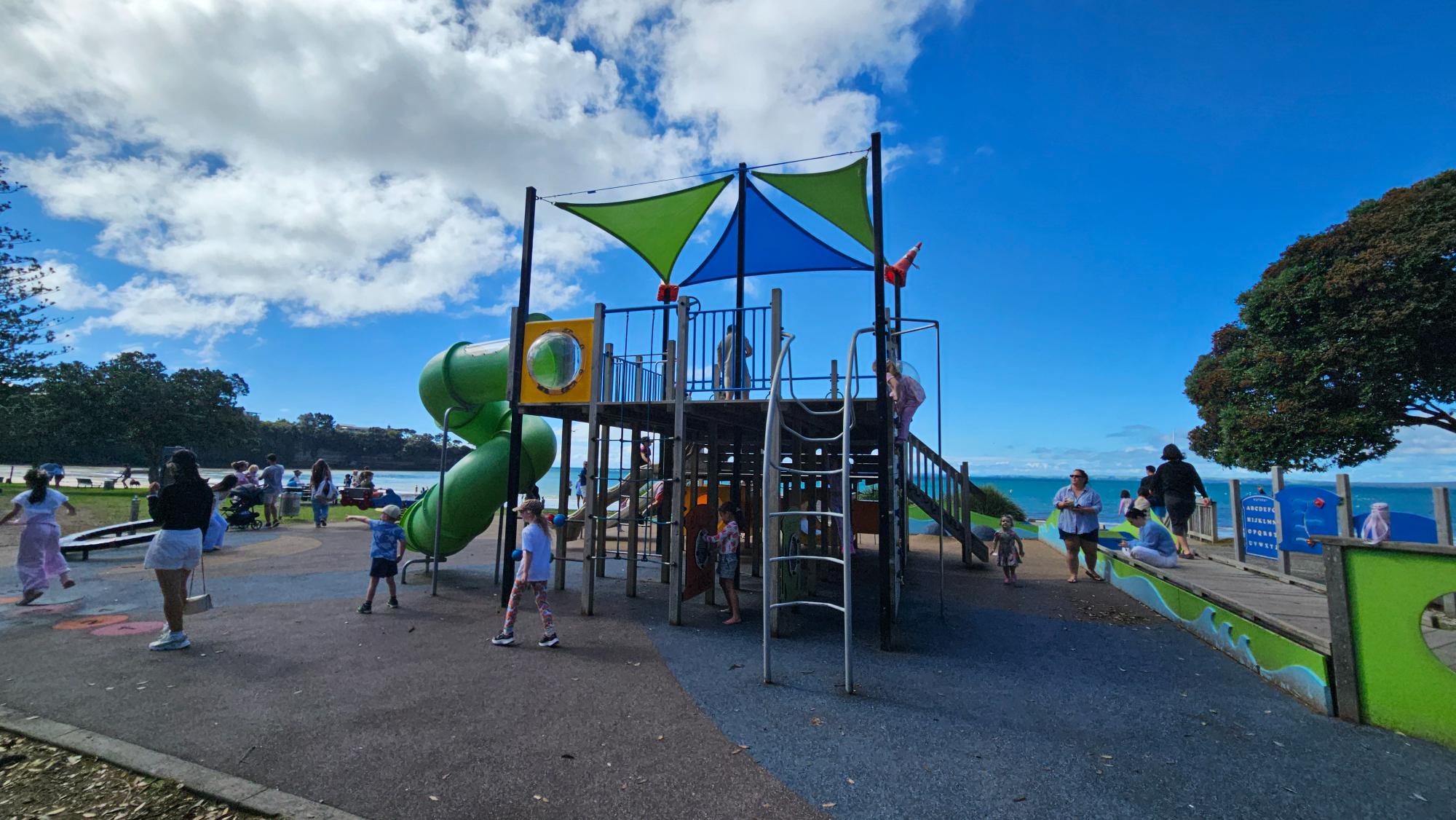 Slide structure and play equipment at Browns Bay Beach Reserve Playground