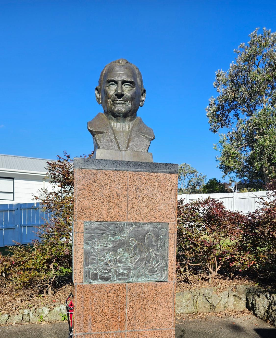 A statue of Rewi Alley sits in the picnic area right next to the playground.