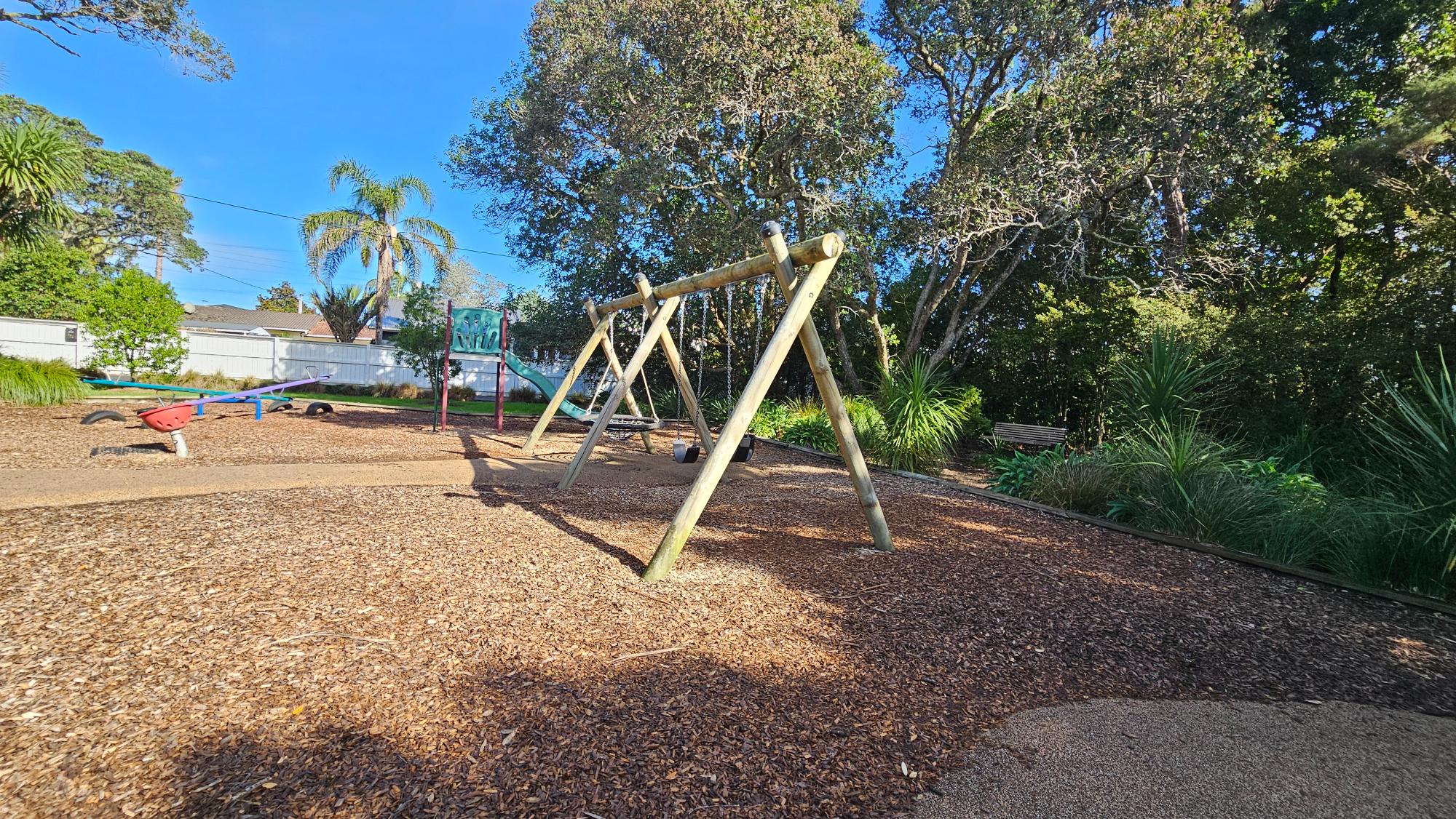 The classics are all present: swings, a slide, and a seesaw.