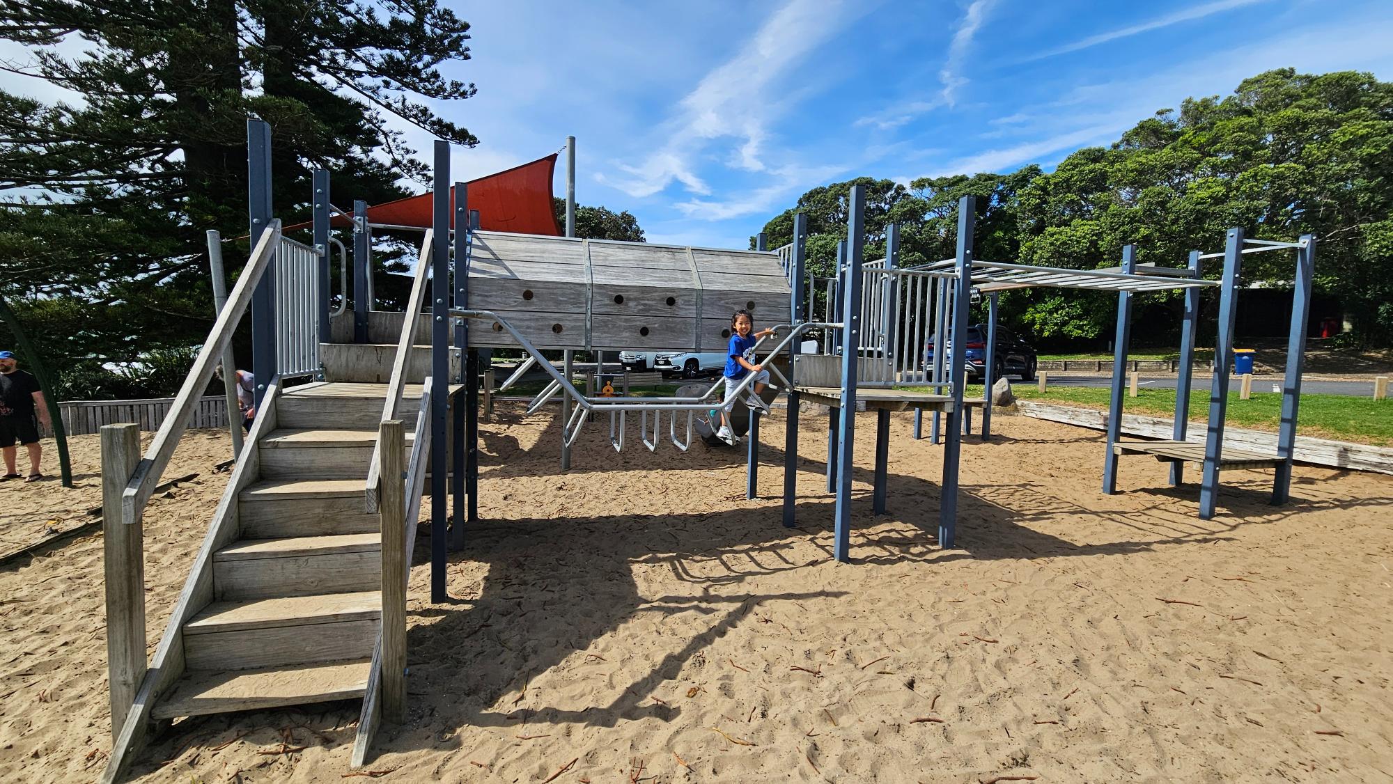 A full-sized monkey bar for bigger kids and a smaller bar that little ones can actually reach