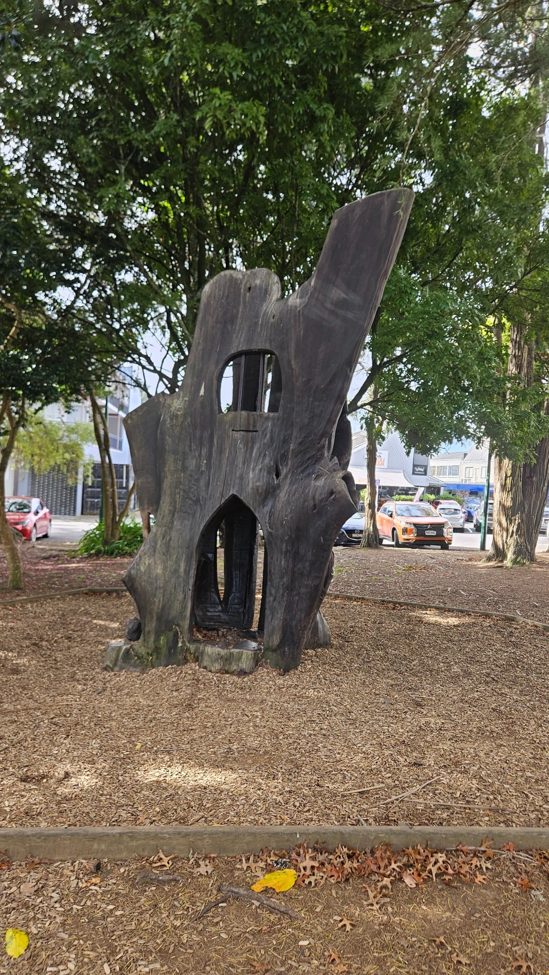 Tucked into one side of the playground is a small play structure, which can be reached via a short set of steps leading up to its second level (our children absolutely loved it).