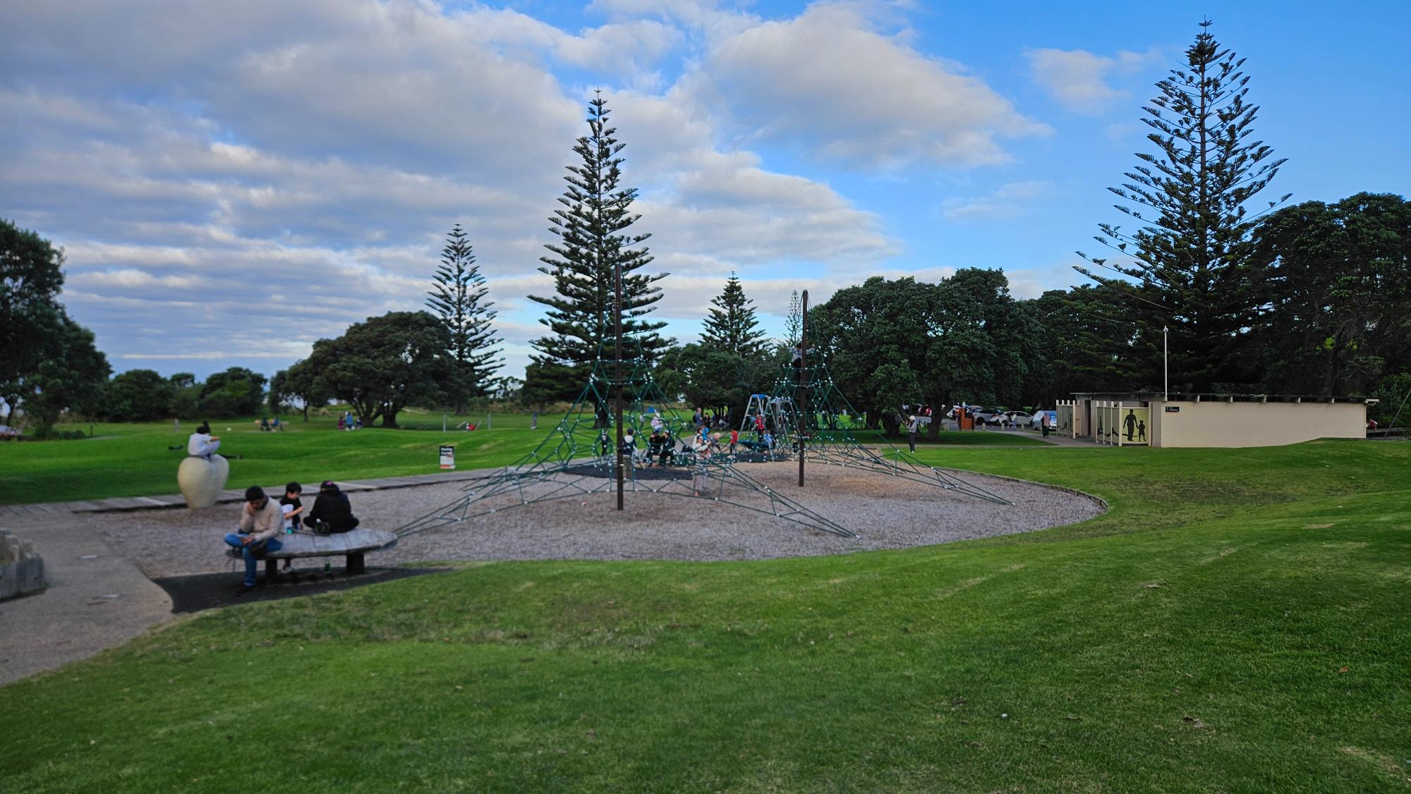 Long Bay Park Playground — open lawns and play equipment spread through Long Bay Regional Park