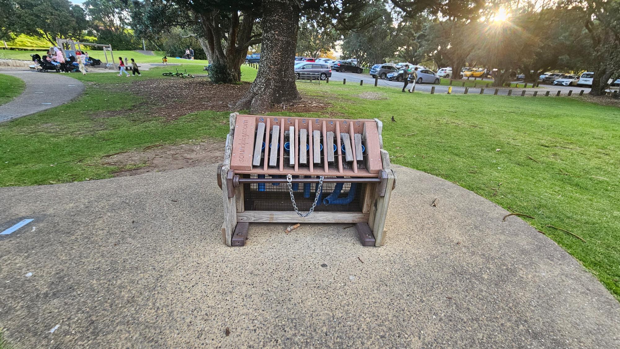 What makes Long Bay Park Playground stand out is how it’s filled with small, cute features scattered all over the place, so part of the fun is spotting them as you explore. The photo shows a tiny wooden marimba.