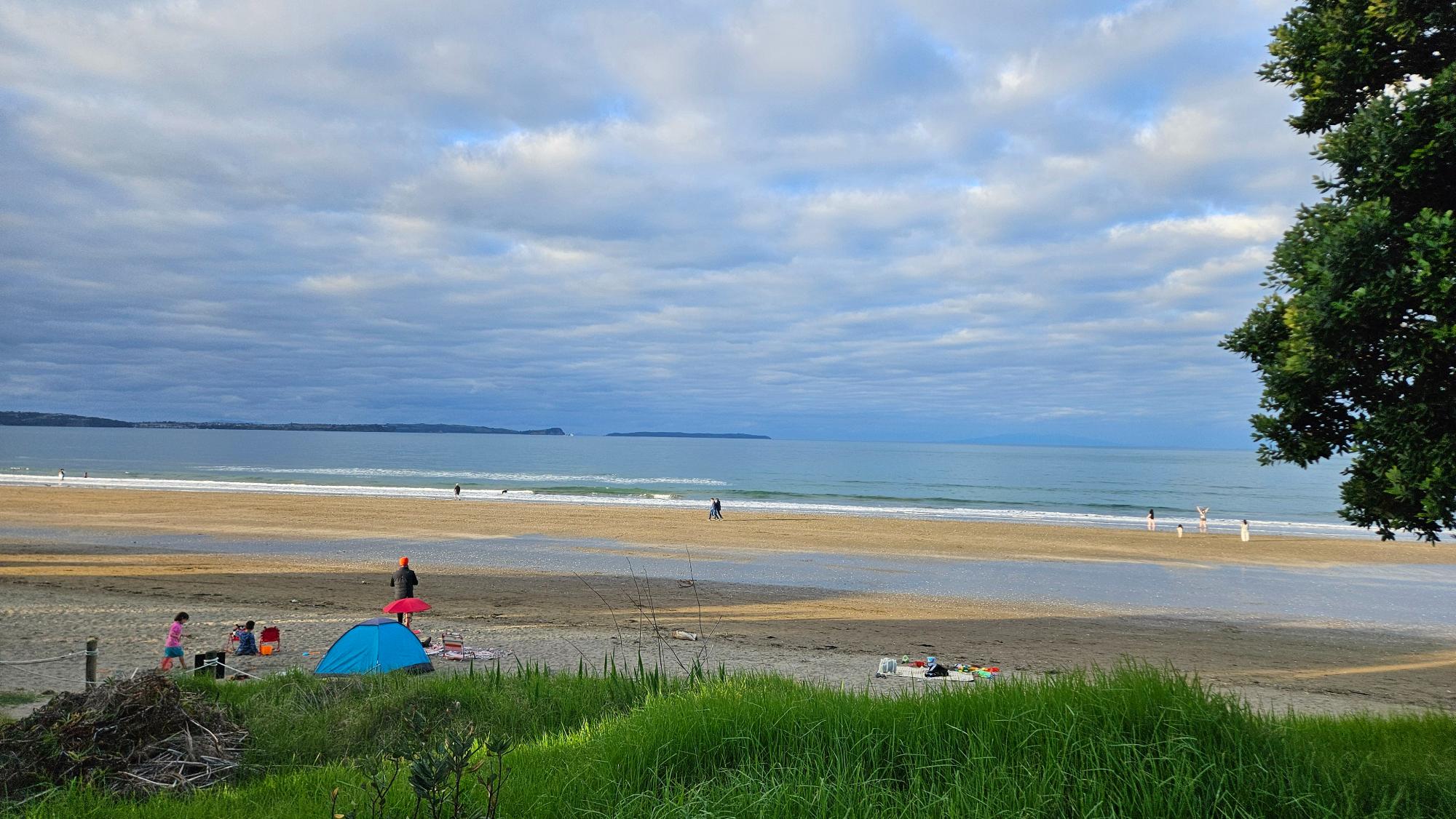 About a minute walk from the playground toward the beach — a beautiful stretch of ocean and coastline.