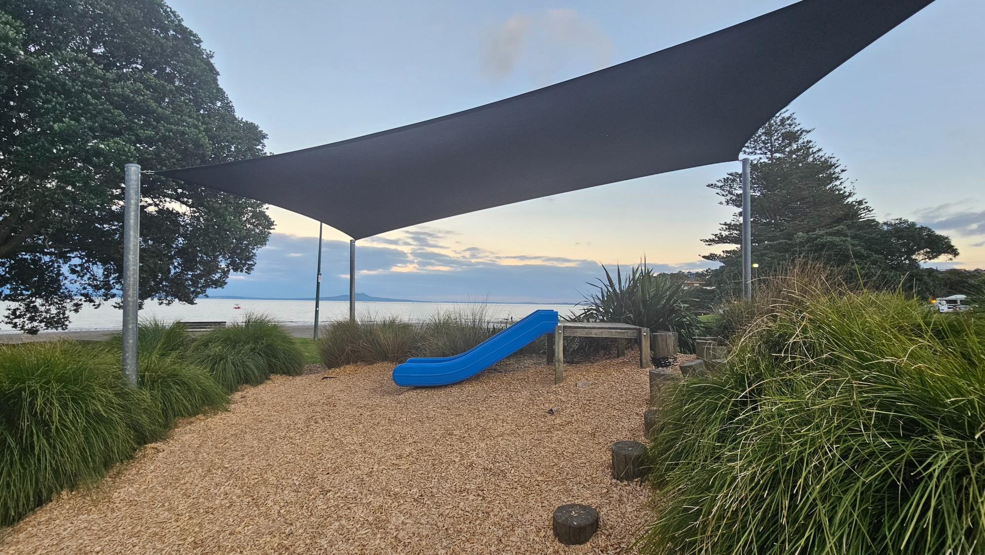 Waiake Beach Reserve Playground — compact play area near the beach on Beach Road