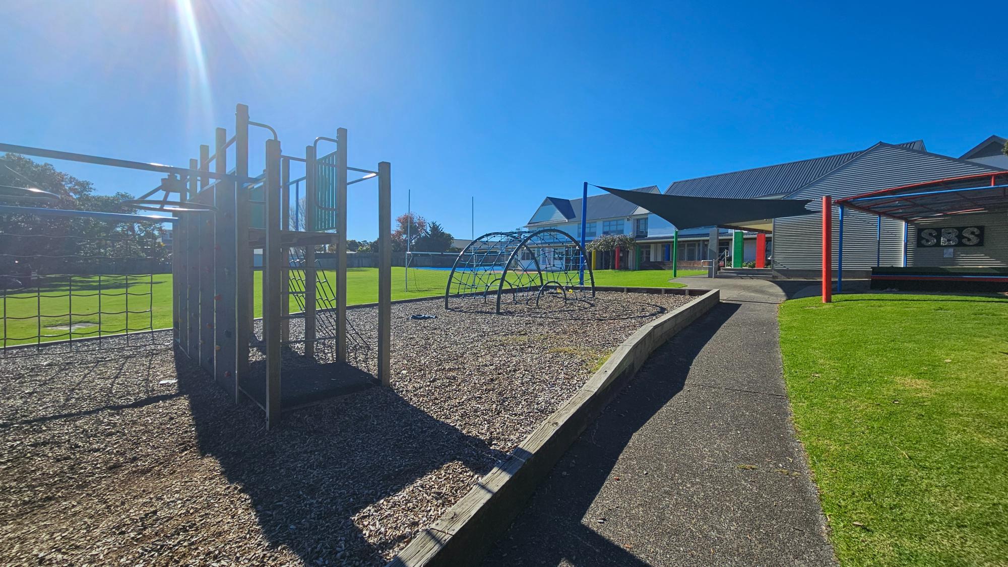 Climbing structures and shade sail at Stanley Bay School, Stanley Point