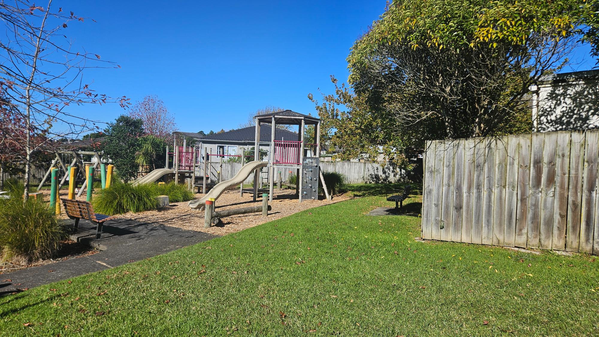 Open grass and play area at Wanita Reserve Playground, Totara Vale