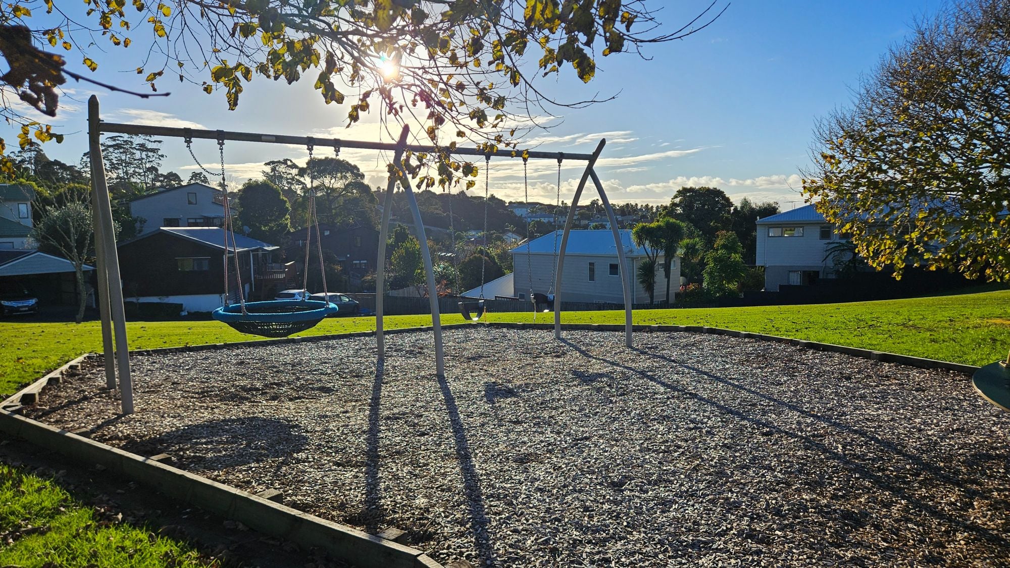 Basket swing and play structures at Bronzewing Reserve Playground