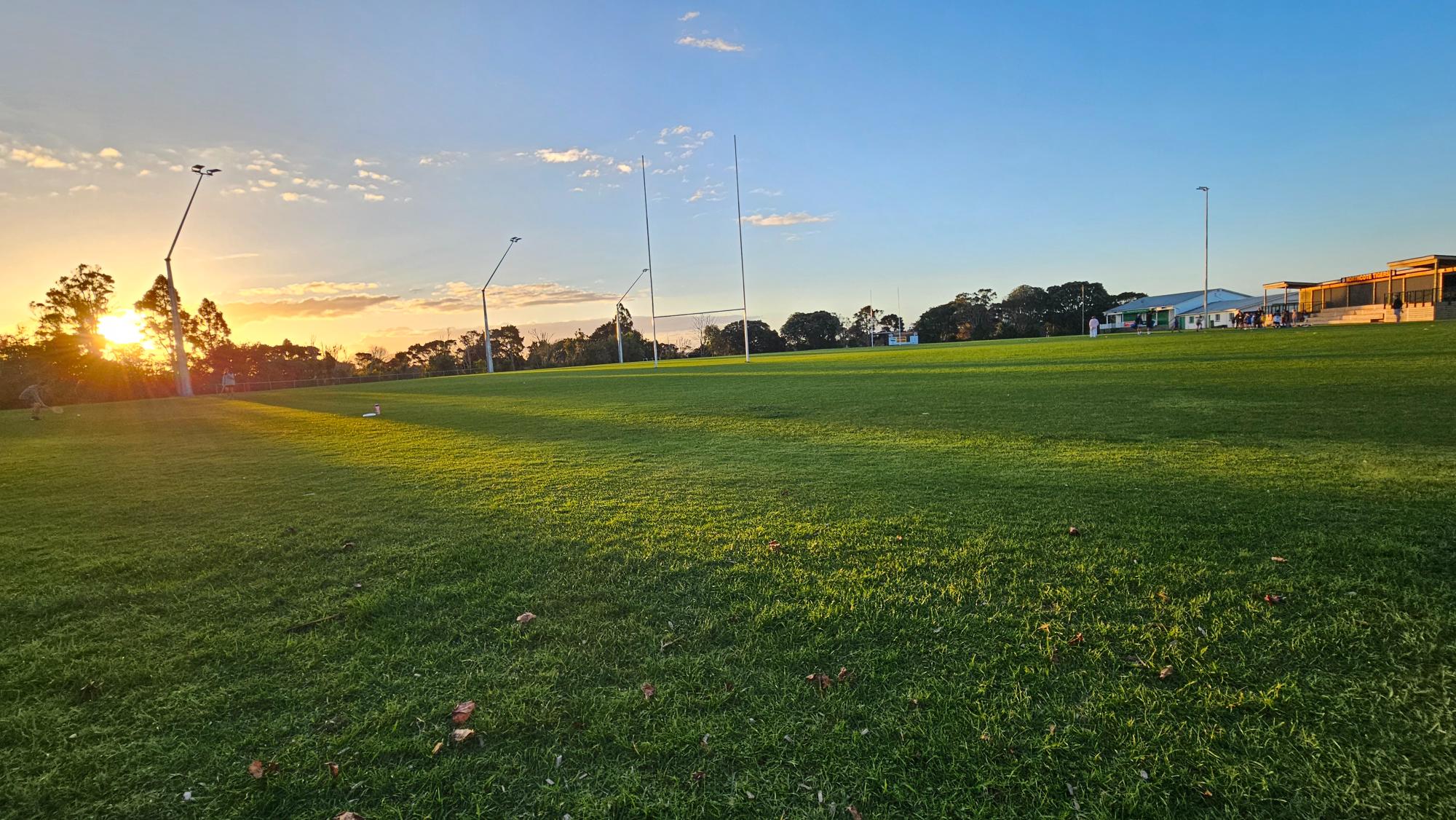 Wide sports field beside Birkenhead War Memorial Park Playground