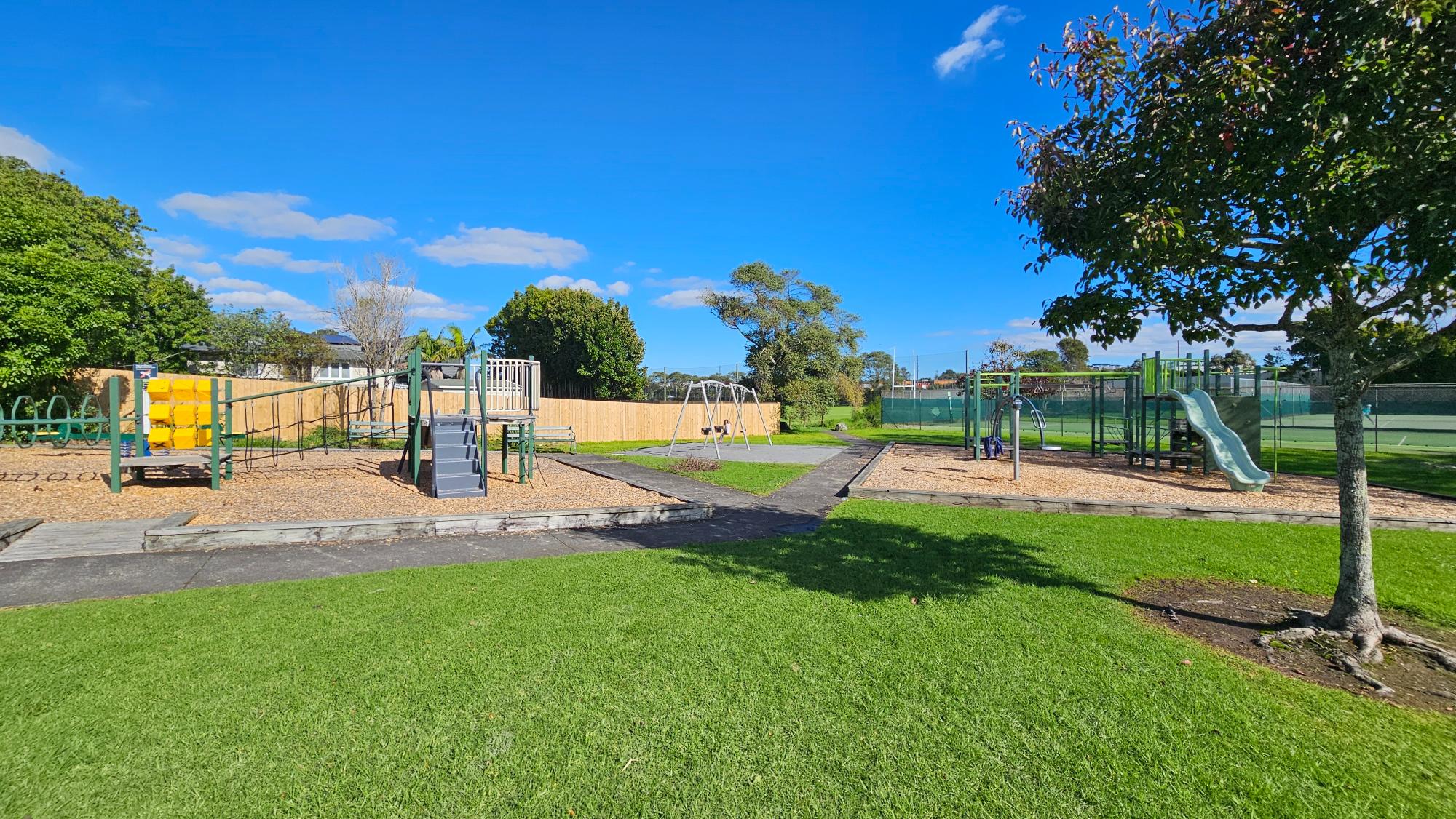 Bond Reserve Playground overview with mid-sized play area and nearby tennis club
