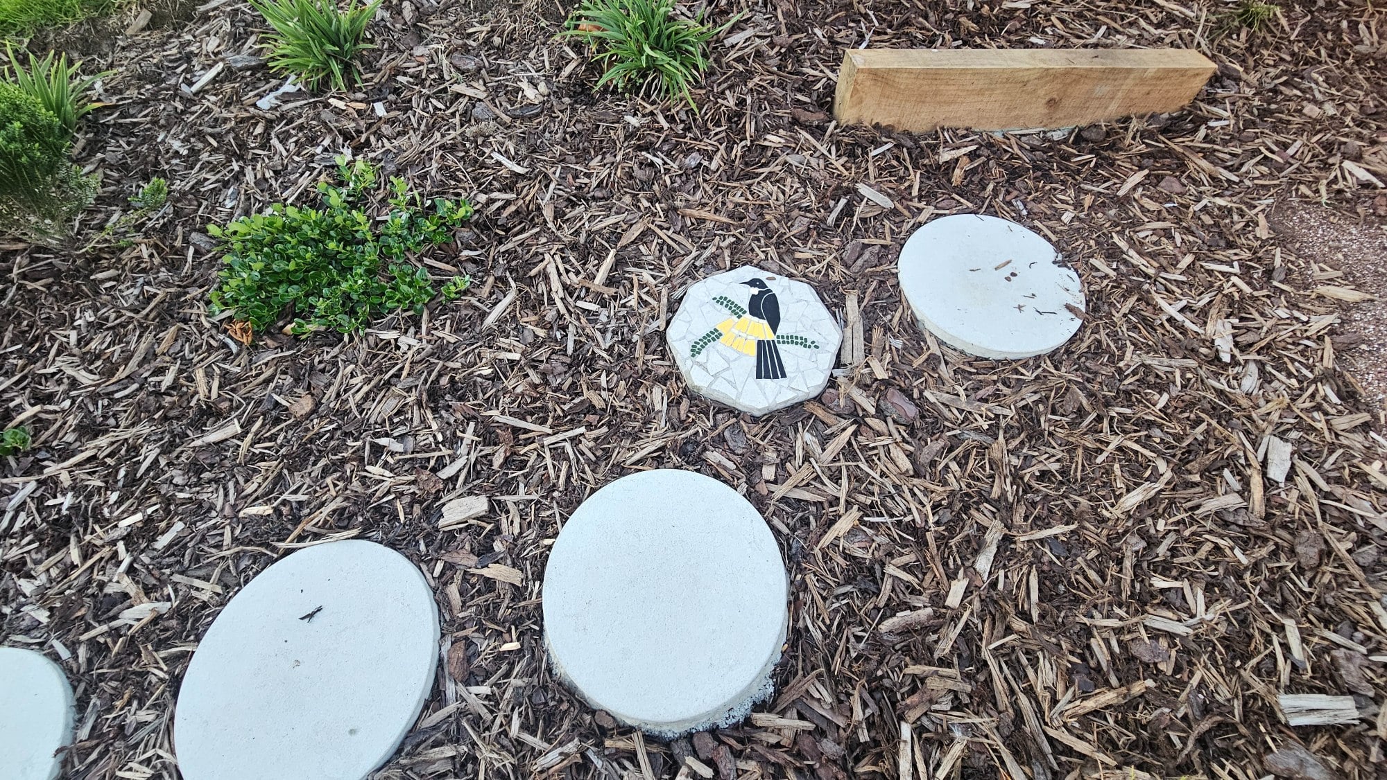 A stepping stone with a bird on it stands out nicely.